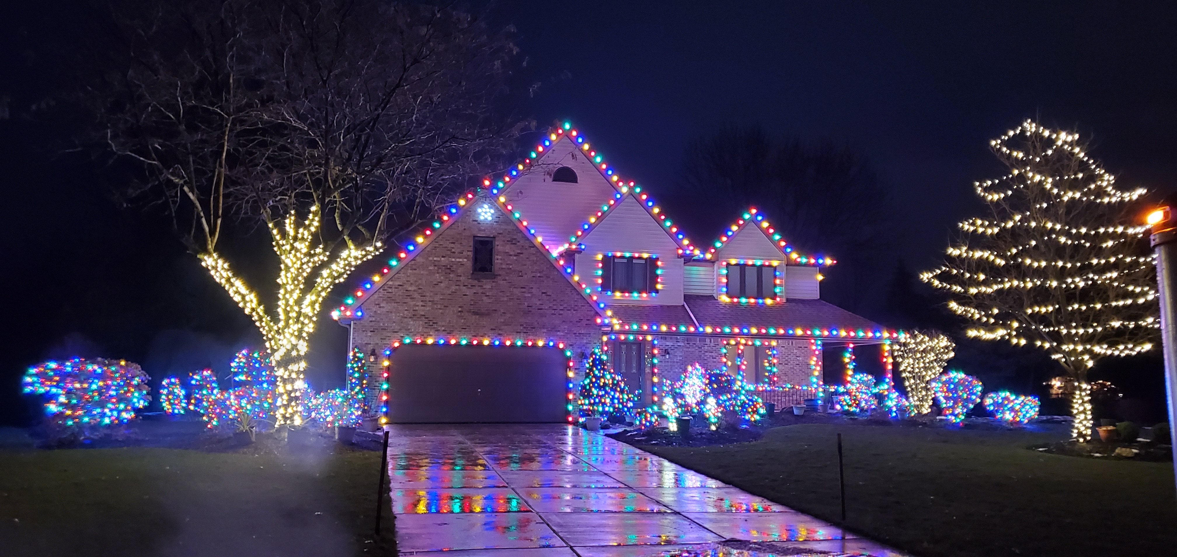 Colorful holiday lighting display by S&K Holiday Lighting